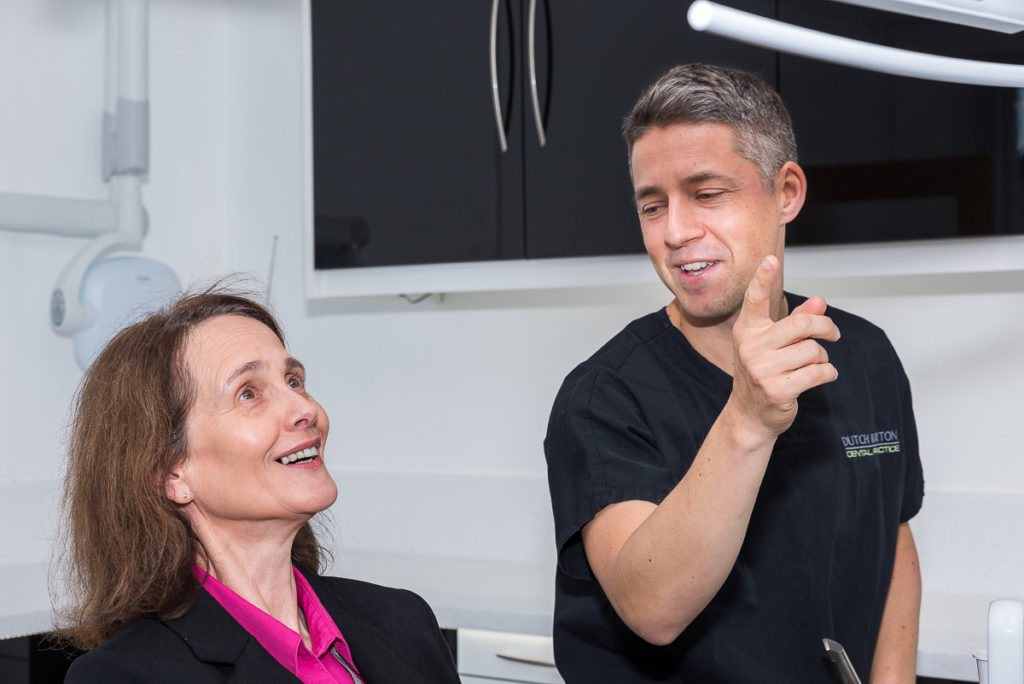 Dentist James MacDonald consulting a female patient