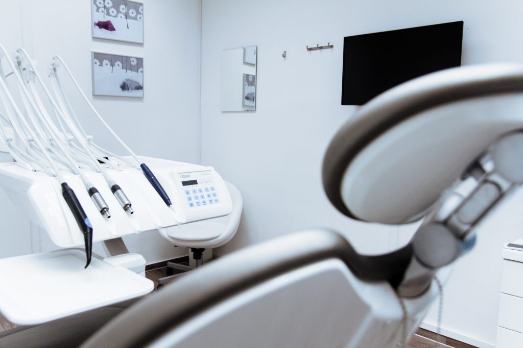 Clean dental office with chair and dental equipment